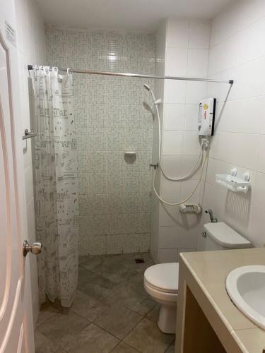 a bathroom with a shower and a toilet at 84 Bar & Guest House Room 1 in Ban Huai Luk (1)