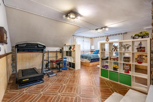 a room with a room with a bed and a room with a room at Casa de Amigos La Latina con piscina, chimenea y barbacoa in Illora