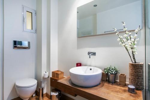 a bathroom with a sink and a toilet at Hilton Area 1BR Executive Flat in Athens