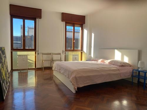 Ένα ή περισσότερα κρεβάτια σε δωμάτιο στο Ca' Beuys In The Kitchen Apartment