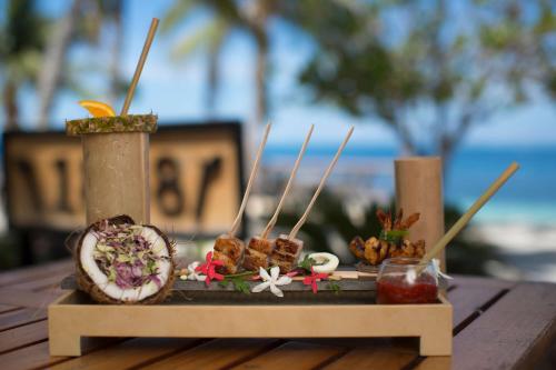 a table with food on skewers on a table at Castaway Island, Fiji in Castaway Island