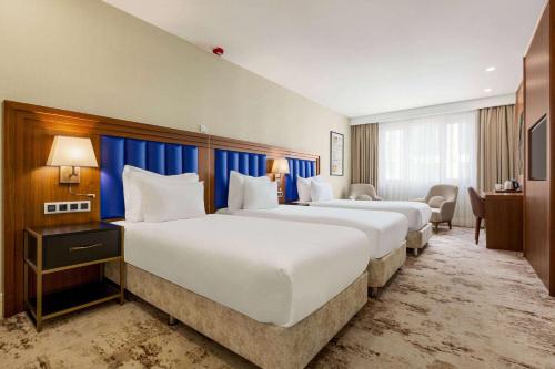 Postel nebo postele na pokoji v ubytování Ramada Plaza Sultanahmet By Wyndham