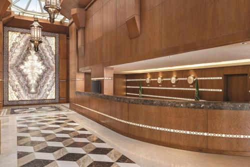 a lobby with a large picture on the wall at Vivid Jeddah Hotel, a member of Radisson Individuals in Jeddah