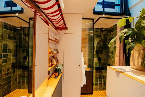 a bathroom with a sink and a shower at Kleinstes Haus Deutschlands in Bremen