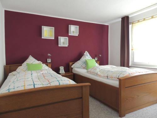 Un pat sau paturi într-o cameră la Pension Neuenrade