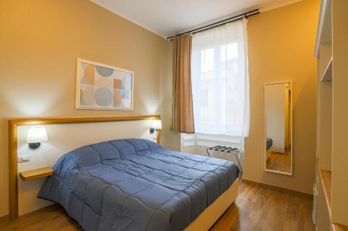 Vuode tai vuoteita majoituspaikassa Binario Zero