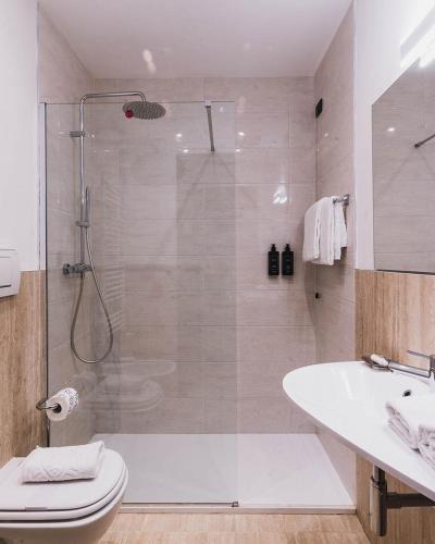 a bathroom with a shower and a toilet and a sink at Ca' Amadi in Venice