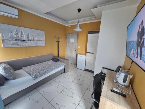 a living room with a bed and a table at Royal Apartments & Rooms in Zagreb