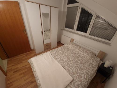 Ένα ή περισσότερα κρεβάτια σε δωμάτιο στο Apartman Sesvete