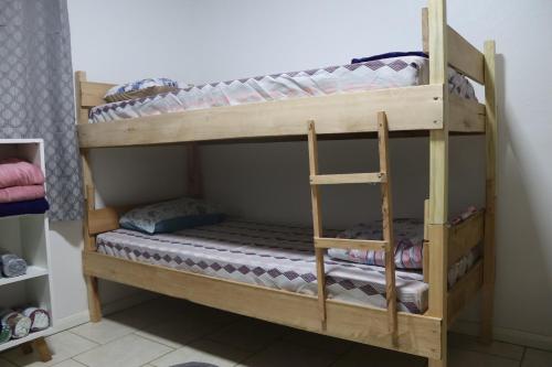 a couple of bunk beds in a room at Casa de Temporada em Gramado in Gramado