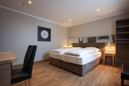 Postel nebo postele na pokoji v ubytování Arthotel ANA Flair