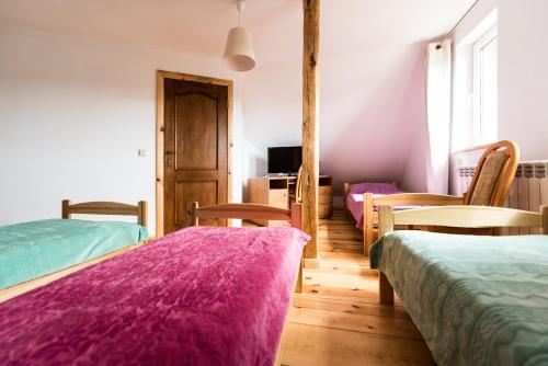 En eller flere senge i et værelse på Czar Podlasia agroturystyka