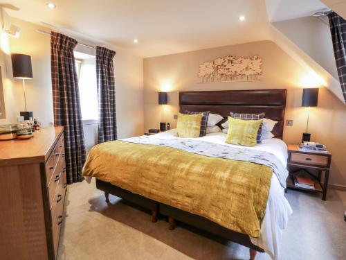 Ένα ή περισσότερα κρεβάτια σε δωμάτιο στο Shepherdess Cottage