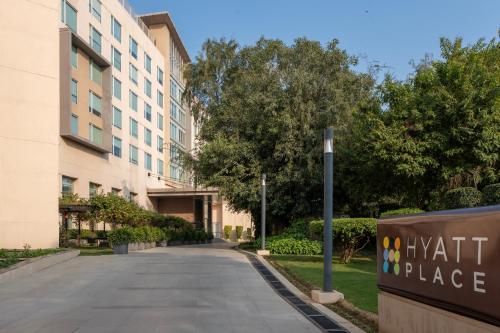 an empty street in front of a building at Hyatt Place Gurgaon Udyog Vihar in Gurgaon