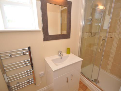a bathroom with a sink and a shower at 1 Bed in Burnham-on-Sea ALHSL in Highbridge