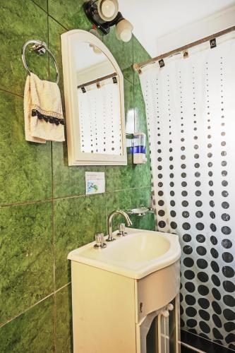 a bathroom with a sink and a shower at Carabelli Propiedades II in Río Grande