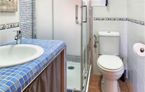 a small bathroom with a toilet and a sink at 2 Bedroom Cozy Apartment In El Campello in El Campello