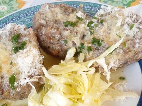 a plate of food with meat and cabbage on a table at Agriturismo Ferienhof Gschloier - Adults only in Laion