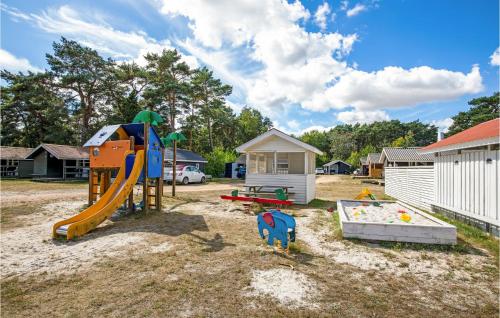 a playground with a slide and a slideintend at Beautiful Home In Nexø With Wifi in Neksø