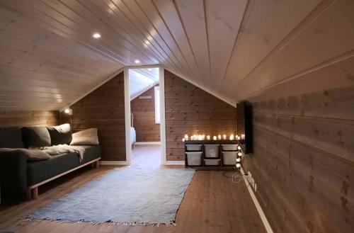 a living room with a couch and a fireplace at Perfect location at Lifjell in Lifjell