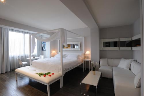 Un pat sau paturi într-o cameră la Park Hotel Sporting