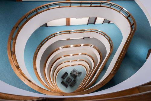 a spiral staircase in a building at Eurostars uHOTEL in Ljubljana