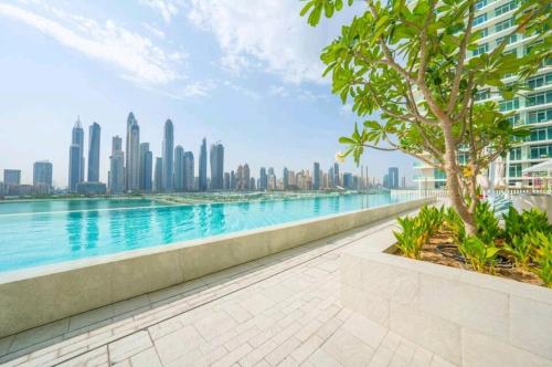a view of the city from the water in a building at Seaside Serenity Perfect Beachfront Holiday Haven in Dubai
