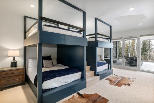 a bedroom with two bunk beds in a room at Quicksilver Haus in Park City