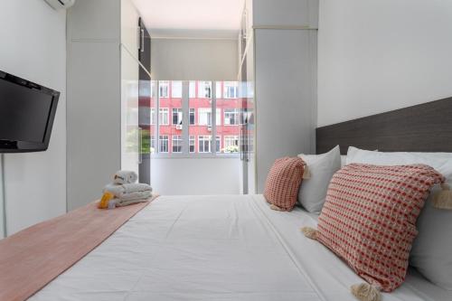 Giường trong phòng chung tại Charme em Copa - Quartos confortáveis - BR401 Z4