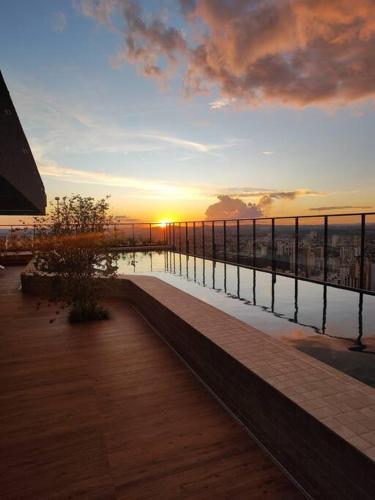 a view of the sunset from a balcony of a building at 2403 apartamento Setor Oeste gyn in Goiânia