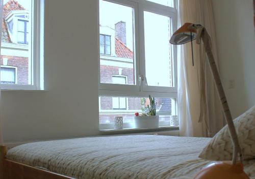 Ένα ή περισσότερα κρεβάτια σε δωμάτιο στο Binnen aan de Singel