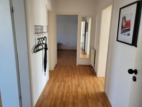 a hallway of an apartment with a wooden floor at holiday home eva in Worms