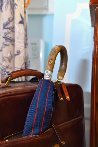 a brown purse with a blue and red tie at Regal House Anzio Manetti 16 in Anzio