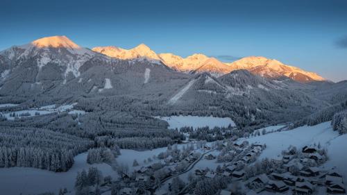 a view of a mountain range with snow and trees at Chalet in Hohentauern - Chalet Ana in Hohentauern