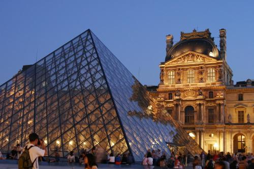a view of the louvre pyramid in front of a building at Beautiful family flat nearby the Flea Market, Stade de France, Montmartre in Saint-Ouen