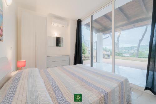 Кровать или кровати в номере Residence Cala Silente