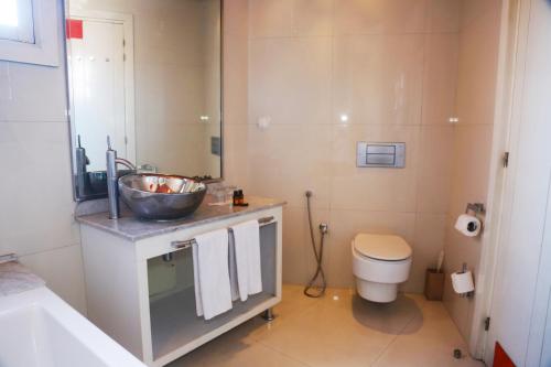 a bathroom with a sink and a toilet at Sky Boutique Ennahda Rennaissance in Marrakech