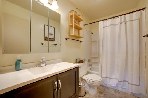 a bathroom with a sink and a toilet at Centrally Located Sparks Condo with Private Patio! in Sparks