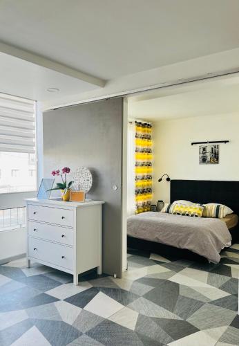 Katil atau katil-katil dalam bilik di Appartement d’architecte
