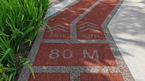 a sidewalk with the words million painted on it at Cityscape Haven - Urban Suites by Ocean Luxe in Jelutong