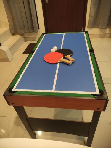 a ping pong table with a ping pong ball on it at Regentown Home near ICE BSD in Cilandak