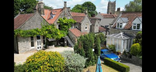 an aerial view of a house with a blue car at The Old Manor House Hotel in Keynsham