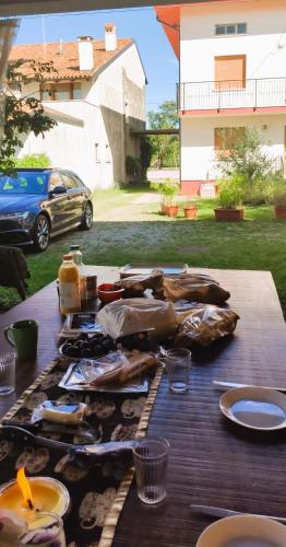 a picnic table with a bunch of food on it at Casa Ortensia in Grions