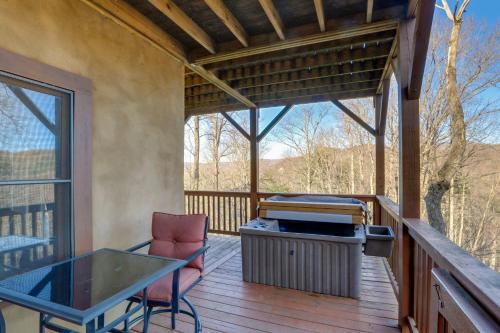 a screened in porch with a table and a grill at Hot Tub and Game Room Powderhorn Mountain Cabin in Powderhorn Mountain