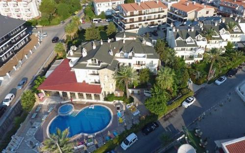 an aerial view of a house with a swimming pool at GREENPARK APARTMENTS in Marmaris