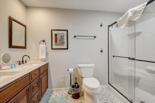 a bathroom with a toilet and a glass shower at Dells Lakefront Escape - Couples or Families in Wisconsin Dells