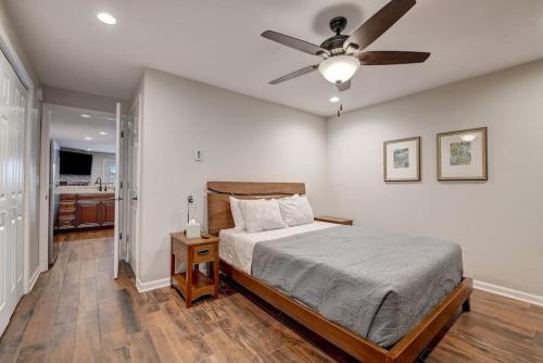 a bedroom with a bed and a ceiling fan at Dells Lakefront Escape - Couples or Families in Wisconsin Dells