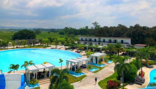 an aerial view of a resort with a large swimming pool at RL RESORT AND LEISURE PARK in Porac