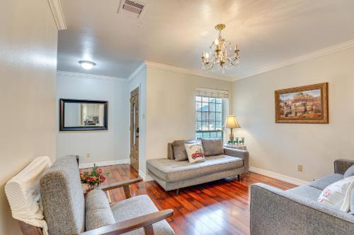 a living room with a couch and a chair at Houston Home with Screened Porch, Near Sugar Land! in Houston