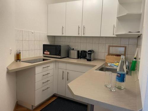 Кухня или мини-кухня в Appartio: Studio-Appartement am Stadtrand
